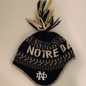 Notre Dame beanie with tassels.